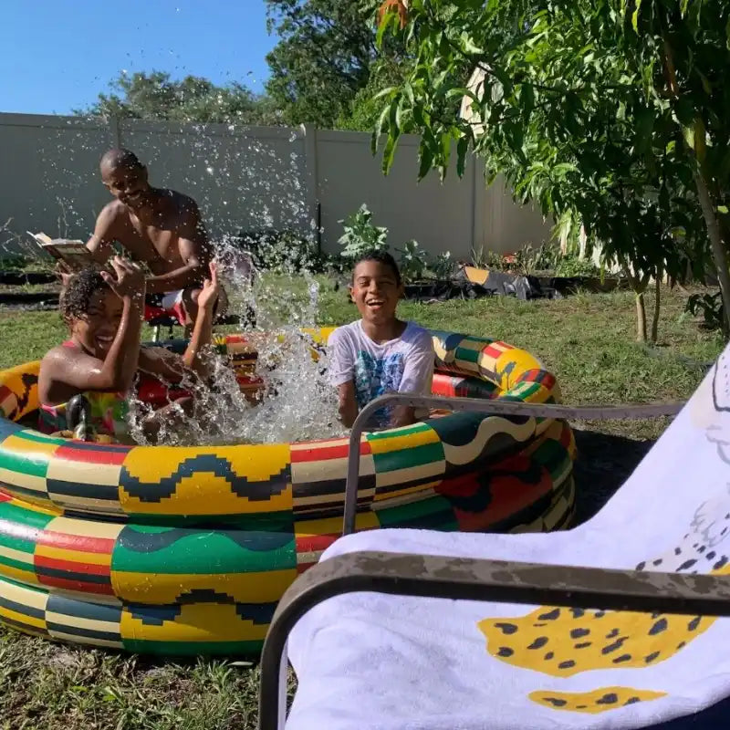 A colorful, homemade tire swimming pool.